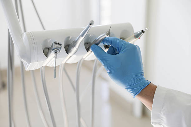 Professional Invisalign Clear Aligners technician working in Baxter Estates, NY